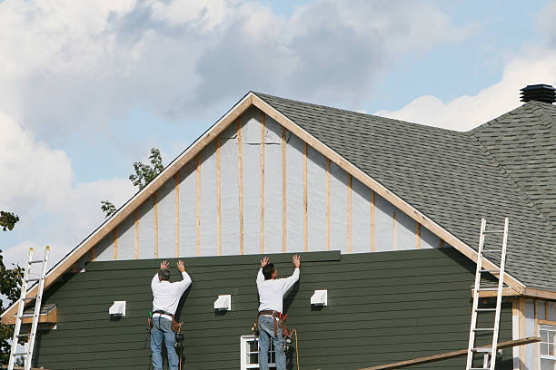 Professional Siding Contractor technician working in Bath, IN